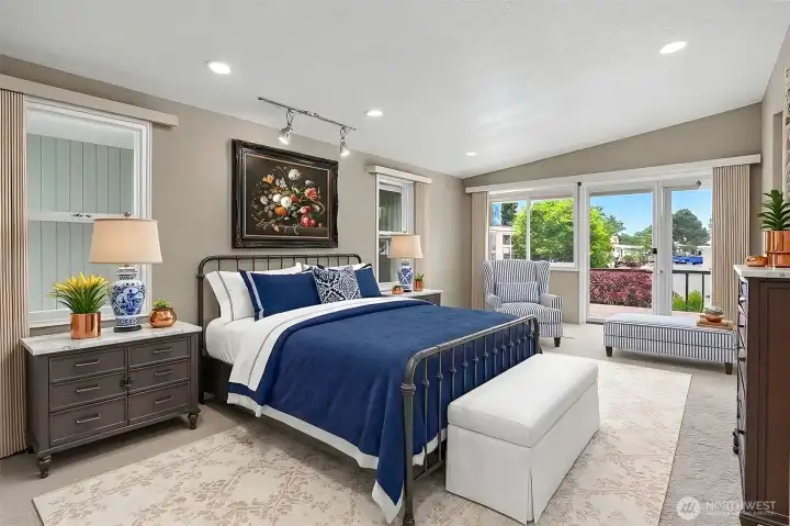 Master bedroom suite with vaulted ceilings, sliding door to light and bright south facing deck and a 3/4 bathroom.  Virtually staged photo.