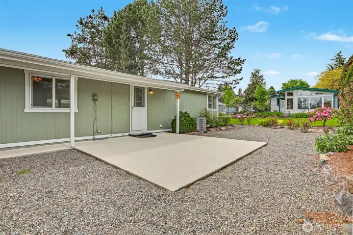 Back patio and courtyard overlooks the community greenbelt that is maintained by the HOA.