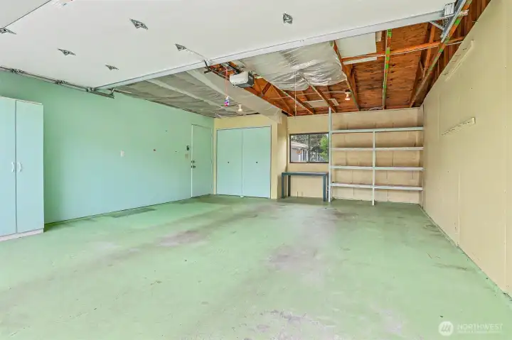 Detached 2 car garage with built in storage and workspace.