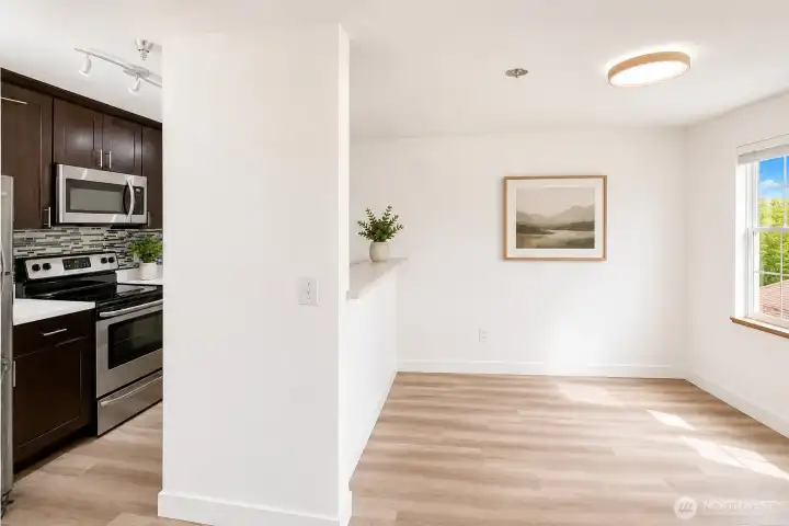 A bright dining area with a generously sized window.