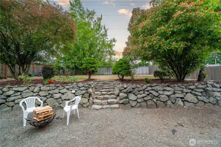 Gravel area of backyard for BBQ fun. Gravel area of backyard for BBQ fun.