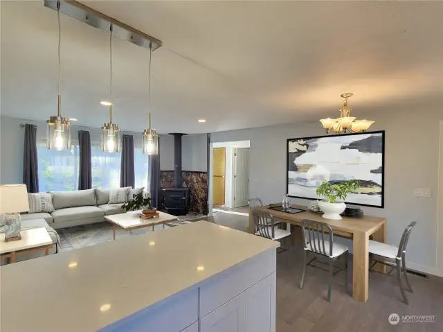 Kitchen opens to entire open concept living. VIRTUALLY STAGED TO SCALE.