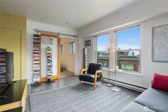 The bedroom closes with a frosted glass sliding door.