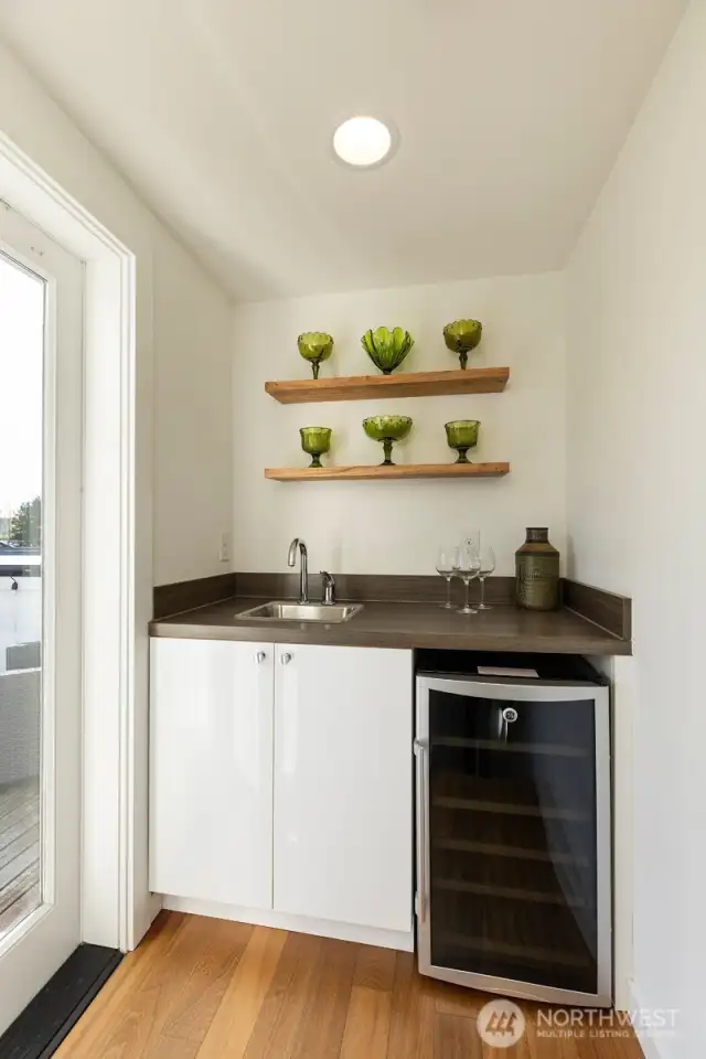Wet bar adjacent to rooftop deck