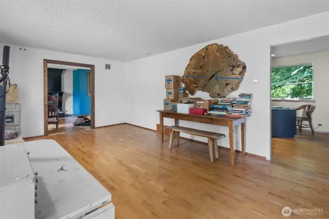 Easy flow floor plan with Family room to the left (with fireplace) and Kitchen on the right.