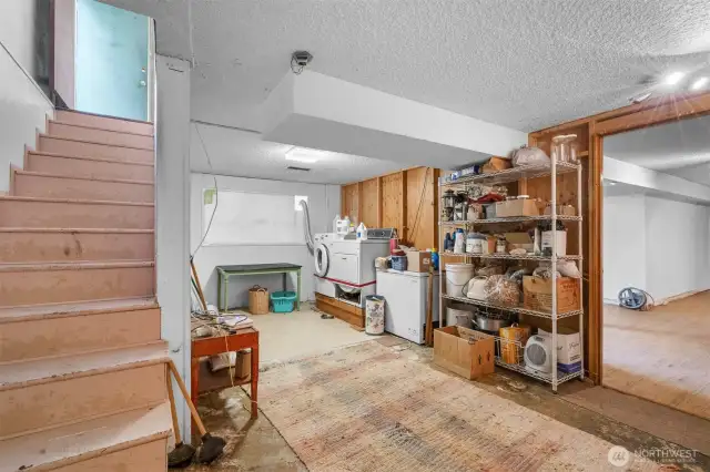 Head down stairs to the unfinished laundry room with storage space. Also providing access to the potential MIL or ADU.