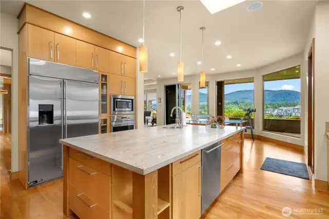 And the opposite kitchen view showing the wall oven and spacious refrigerator.  You can see how it flows seamlessly in to the informal dining area.