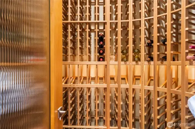 Perfect for wine enthusiasts, this impressive built-in wine storage system offers beauty and function. With space to showcase a large collection, the custom-designed rack features elegant woodwork, open display rows, and secure bottle storage. Whether you're a casual sipper or a serious collector, this wine rack adds a sophisticated touch and keeps your favorite vintages within easy reach.