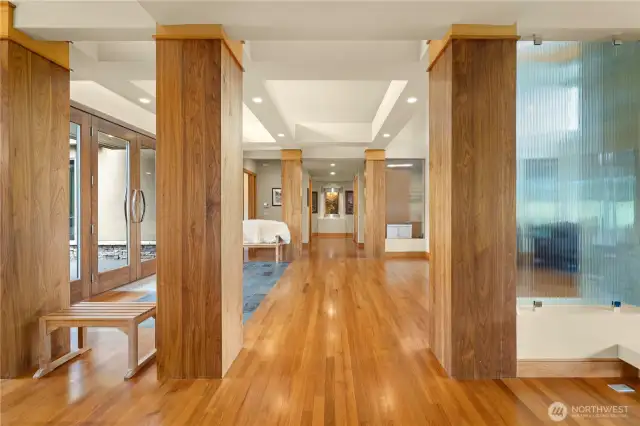 From the formal dining room looking toward the impressive grand entry and down the hall beyond to the gorgeous waterfall feature.