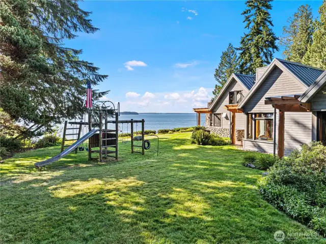 Big toy play structure with expansive water views.