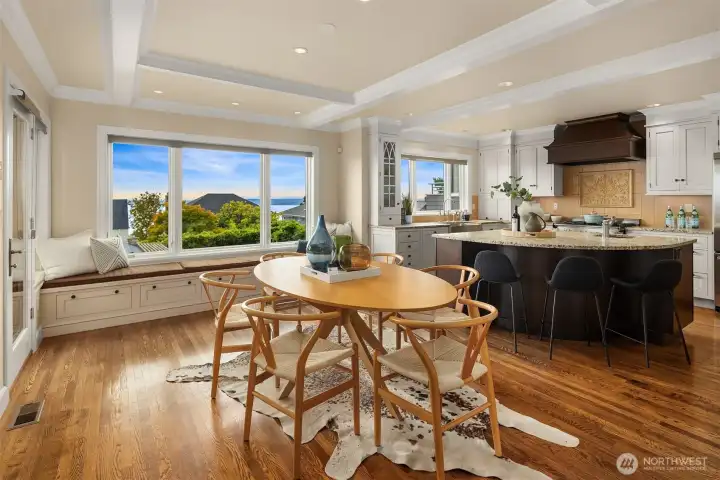Utilizing the built-in seating and with a larger table, you could easily host a sit-down dinner for 8-10 people.  A covered deck off of this space delivers al fresco view dining year round.