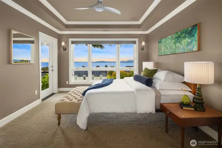 The spacious Primary Suite enjoys sweeping and mesmerizing water/mountain/island views through expansive windows as well as its own private deck...