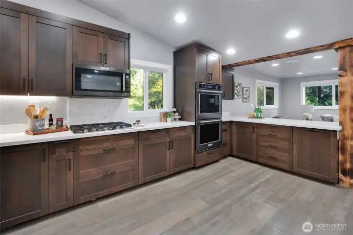 Rich wood cabinetry pairs beautifully with the quartz countertops.