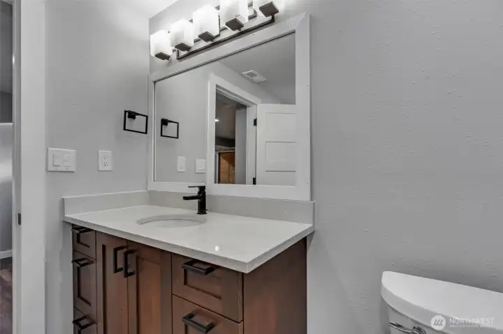 Well-dressed three quarter bath located on lower level.