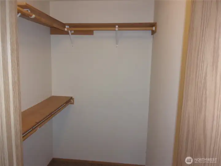 Walk-in closet in primary bedroom.