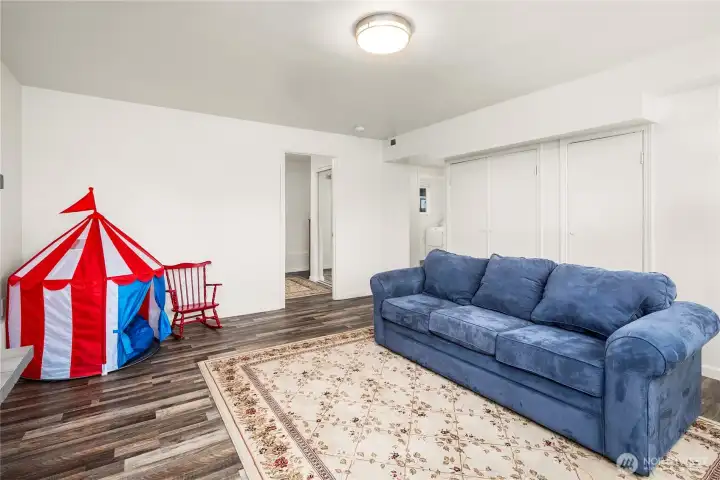 Utility room with gas furnace, gas water heater, storage and water shut valve under the stairs.