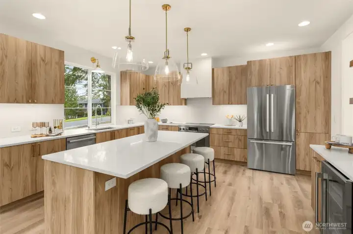 A kitchen designed to gather — generous island, custom cabinetry, and quartz counters.
