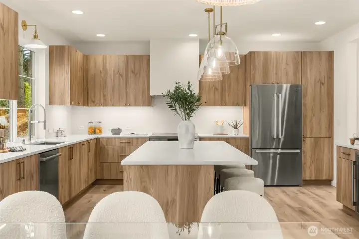 Bellmont cabinetry, Calacatta quartz, and Bosch appliances with a 36” induction range.