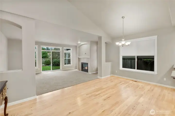 Bright and airy living room flows seamlessly into the dining space