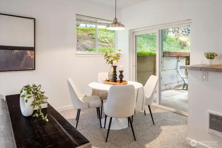 Dining area with sliding door to private patio.
