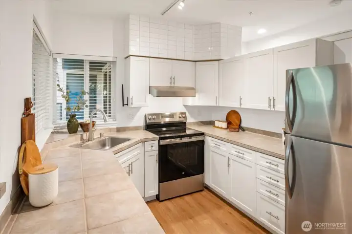 Kitchen with stainless steel appliances.