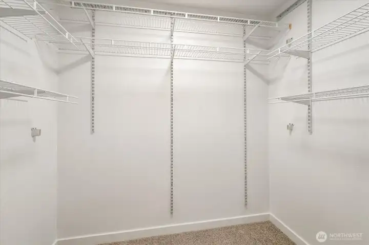 Primary bedroom walk in closet.