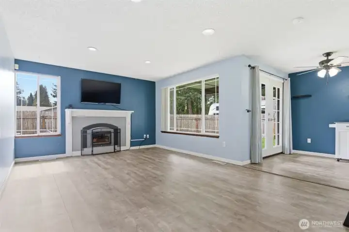 Family room with gas fireplace, large windows let natural light flood this space! Family room with gas fireplace, large windows let natural light flood this space!