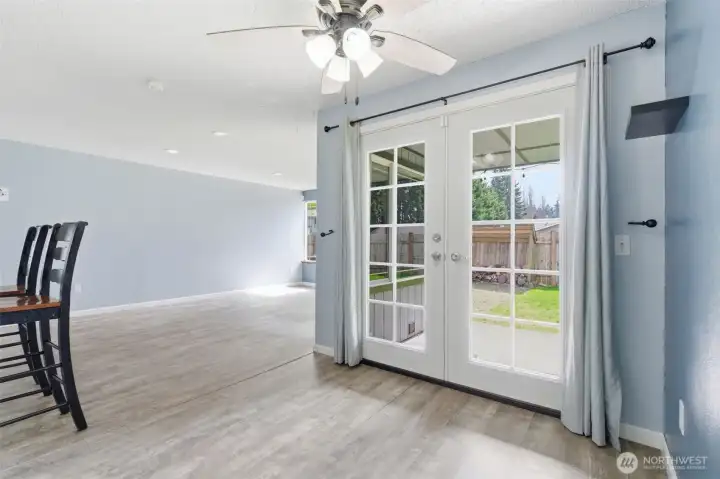 French doors lead to fabulous back yard and gathering space. French doors lead to fabulous back yard and gathering space.