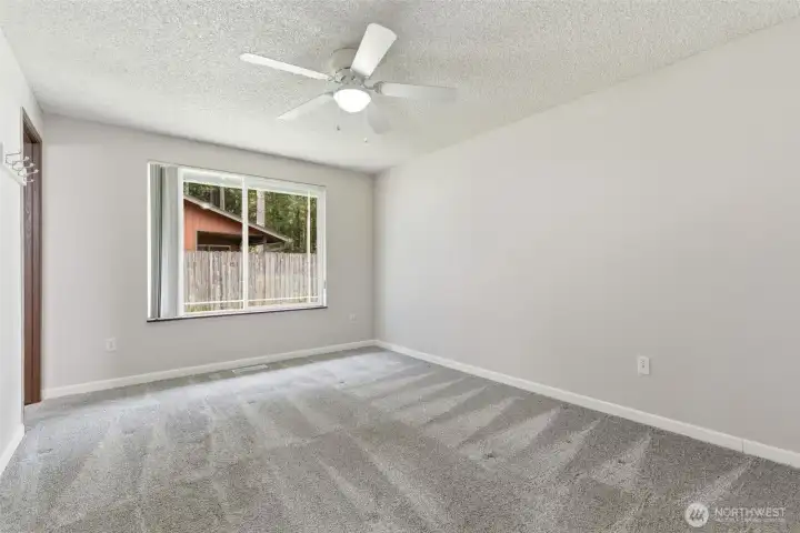 Primary bedroom w/ceiling fan and 3/4 bath attatched Primary bedroom w/ceiling fan and 3/4 bath attatched