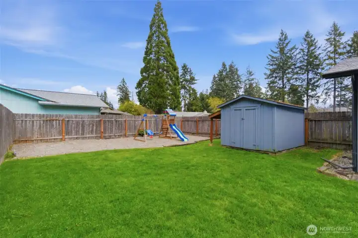 Dedicated play area with pea gravel and play structure. Dedicated play area with pea gravel and play structure.