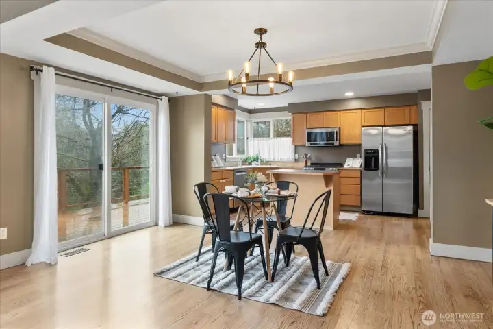 Dining room with sliding door leading out to backyard.
