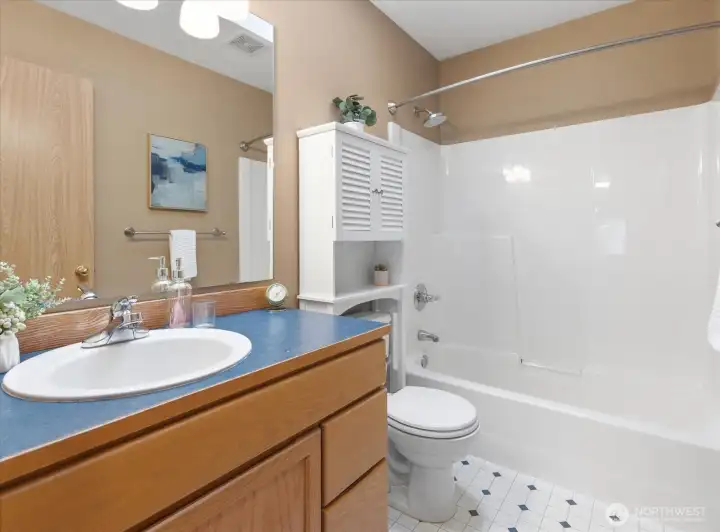 Full bathroom located on upper level.