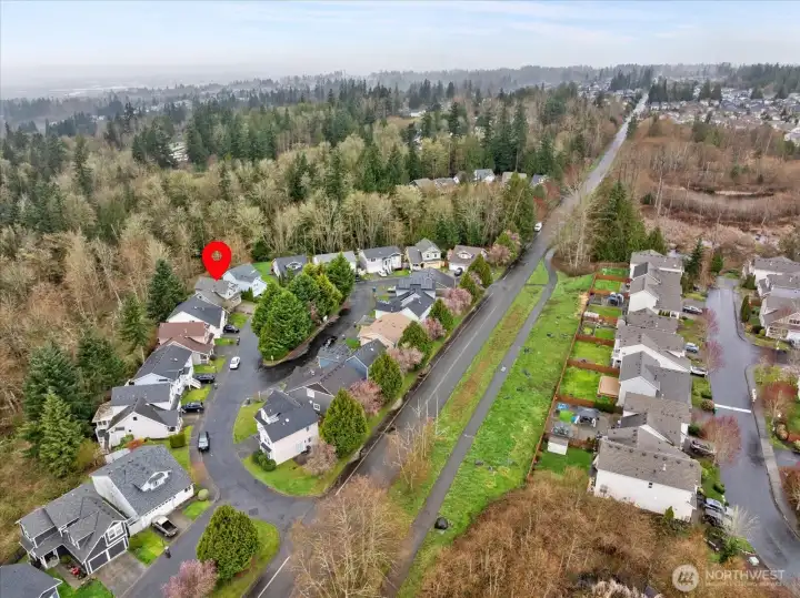 Aerial view of the home and neighborhood looking eastward.