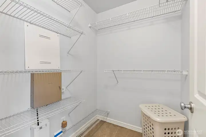 Second of 2 walk in closets in primary bedroom