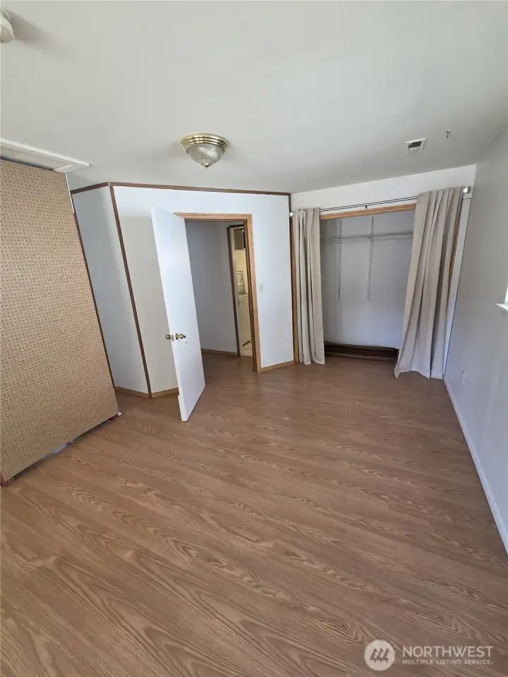 Off the hallway to the bathroom, a large primary bedroom has enough space for all your needs.