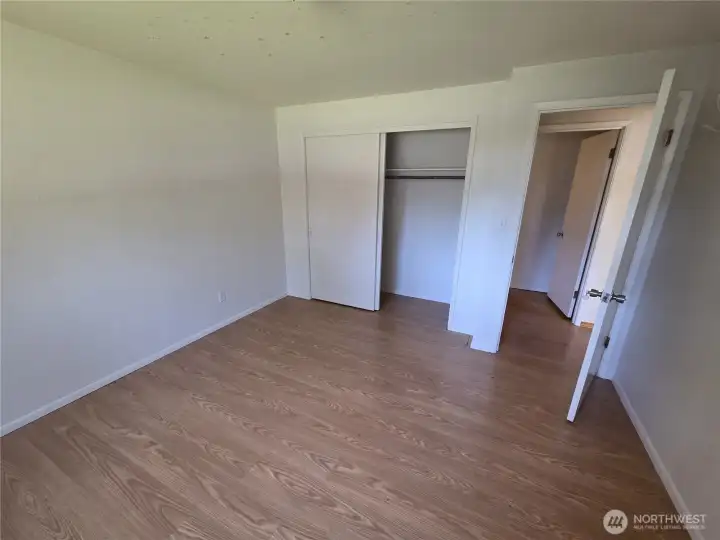 Accross the hall, the 2nd bedroom is larger ,  11 x 15 feet.
