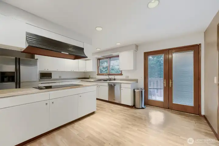 Kitchen with French door to upper deck