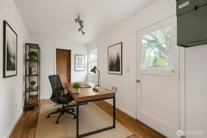 Lower-level office space, virtually staged, is not included in the sq ft. (about 780)