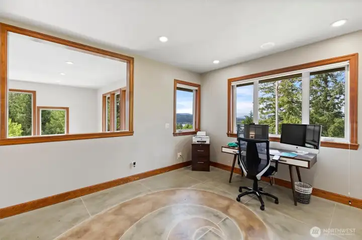 Open upstairs office floods with natural light