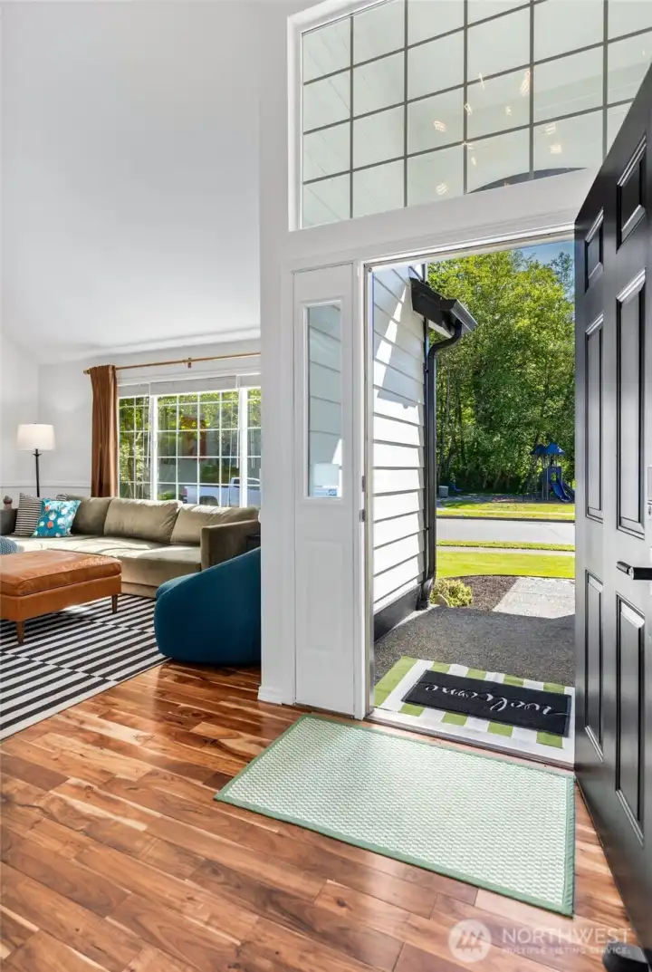Floor to ceiling light coming in through this gorgeous entryway. Hardwood floors throughout main level