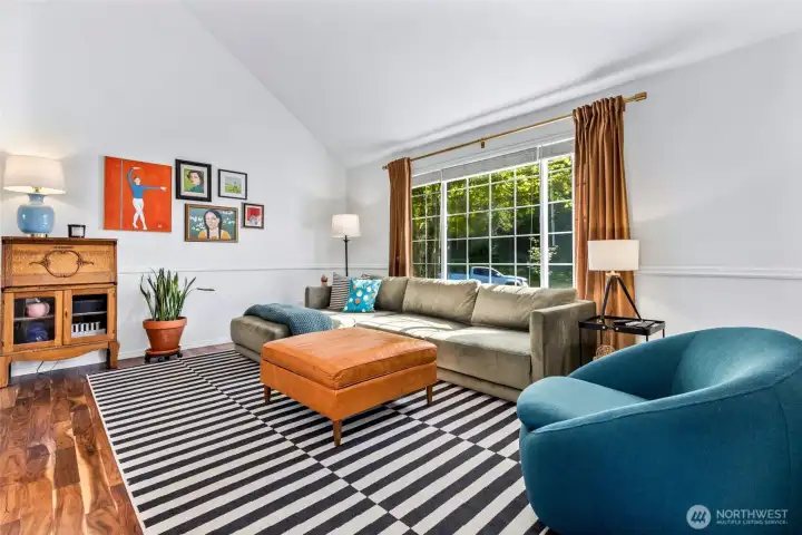 Living room in front of home is light and bright and perfect for entertaining