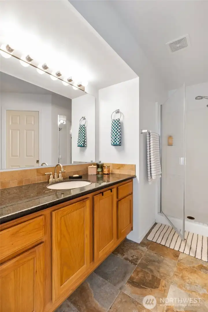 Primary bathroom with heated floors and walk-in closet