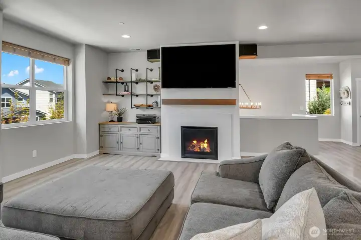 Up the stairs to the main level great room. Spacious layout with fireplace and built in cabinetry.