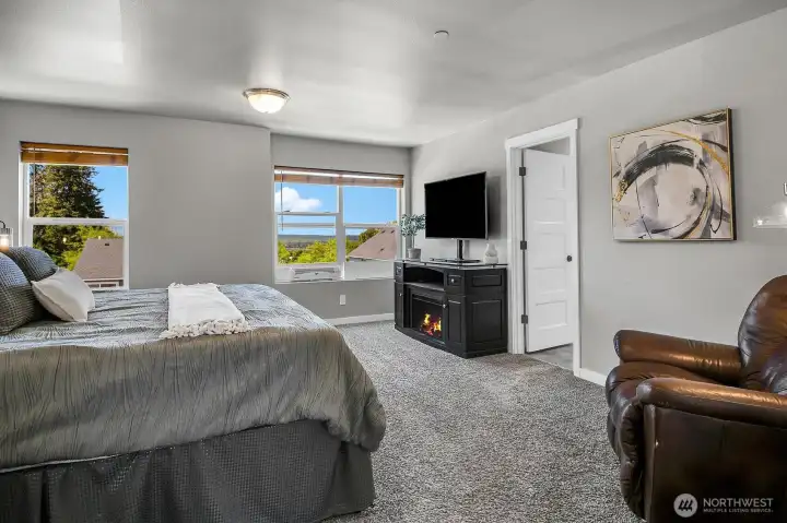 Really spacious primary bedroom on the upper level has west facing views.