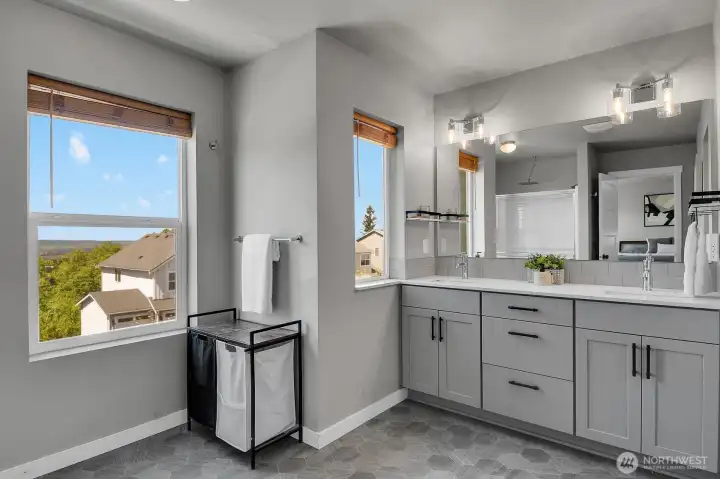 Primary bath with dual vanity and lots of storage.