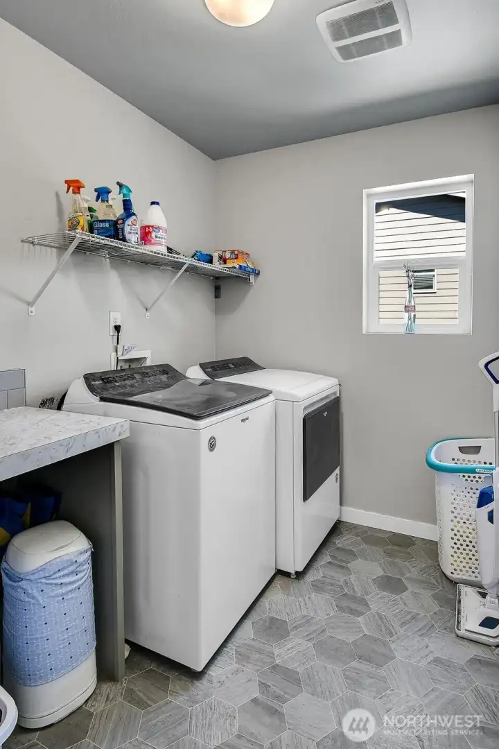 Convenient upper level laundry.