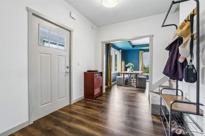 Entry way welcomes you to the living room and dining room. Stairs to the upstairs. Entry way welcomes you to the living room and dining room. Stairs to the upstairs.