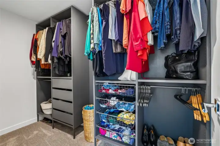 Walk in closet primary bedroom. Walk in closet primary bedroom.