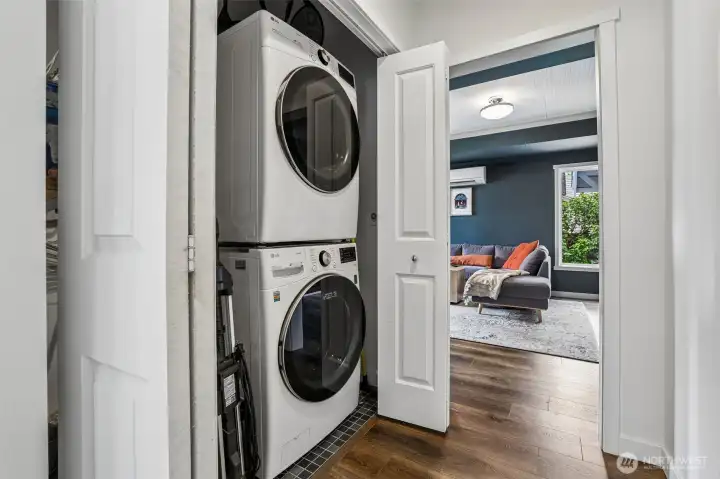 Utility closet with stacked front loading washer and dryer included. Utility closet with stacked front loading washer and dryer included.