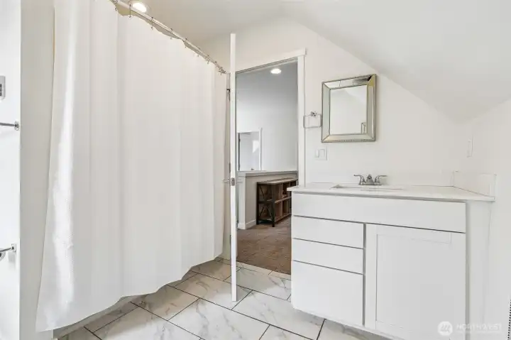 Second floor bathroom with bath/shower surround. Second floor bathroom with bath/shower surround.